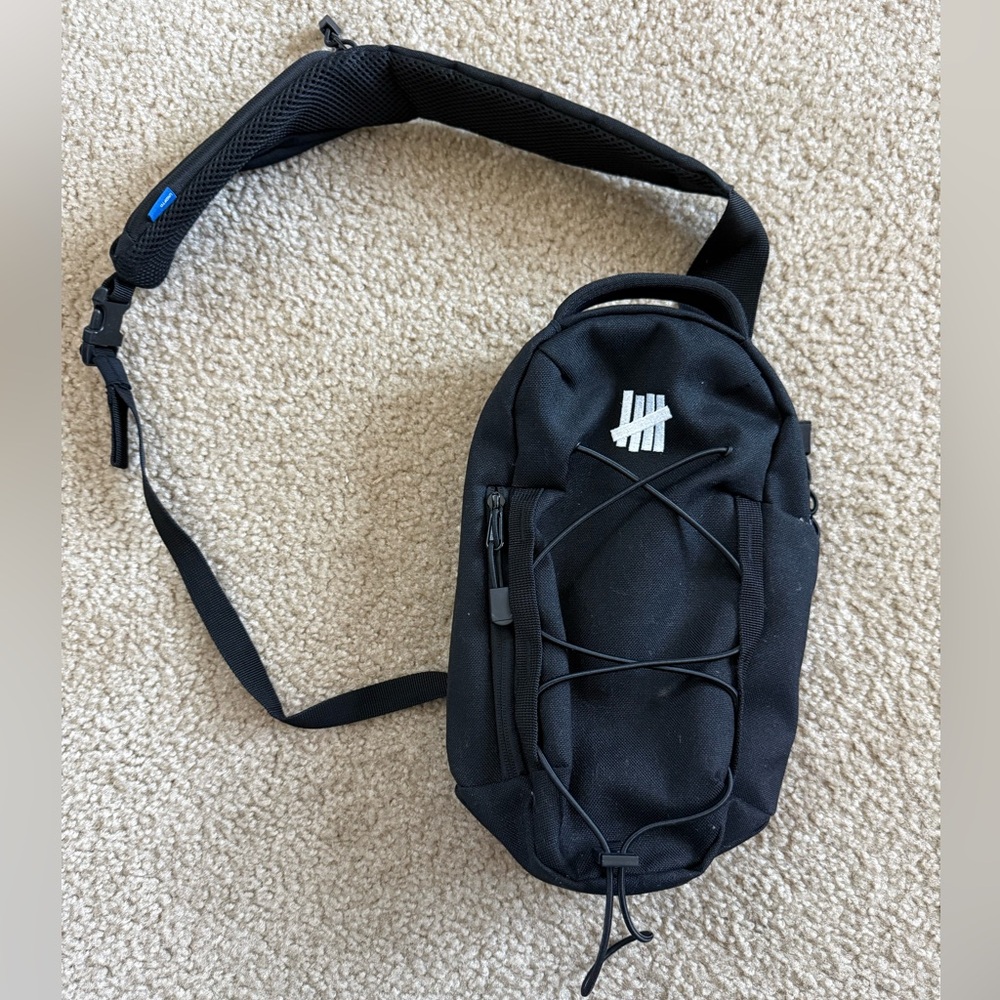 Undefeated Mini Cross Body Bag
